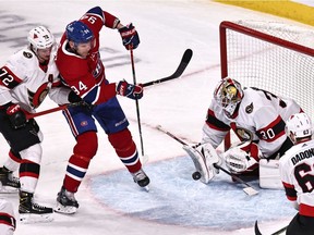 Ottawa Senators goaltender Matt Murray makes a save against Canadiens' Corey Perry (94) as defenceman Thomas Chabot (72) defends during the second period at the Bell Centre on Saturday, April 17, 2021, in Montreal.