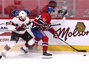 Canadiens' Jonathan Drouin (92) plays the puck against Ottawa Senators'  Victore Mete (98) during the first period at Bell Centre on Saturday, April 17, 2021, in Montreal.