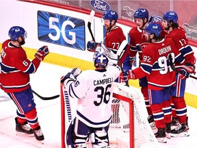 Montreal Canadiens right wing Josh Anderson (17) celebrates his goal against Toronto Maple Leafs goaltender Jack Campbell with teammates during the second period at Bell Centre on Monday, April 12, 2021.