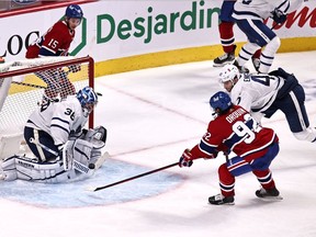 Toronto Maple Leafs goaltender Jack Campbell (36) makes a save against Montreal Canadiens left wing Jonathan Drouin (92) as left wing Pierre Engvall (47) defends during the third period at Bell Centre April 12, 2021.