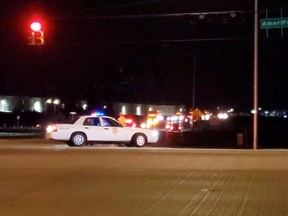 Police block an intersection after shooting incident at a FedEx facility in Indianapolis April 16, 2021.