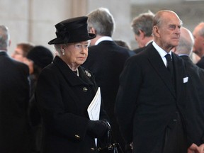 Queen Elizabeth II and Prince Philip, Duke of Edinburgh attend the Ceremonial funeral of former British Prime Minister Baroness Thatcher at St Paul's Cathedral on April 17, 2013 in London, England.