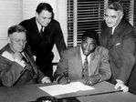 Jackie Robinson makes his professional baseball debut with the Montréal  Royals