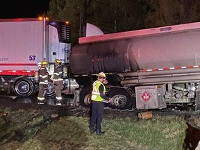 First responders on the scene of a tanker truck fire near the Ontario-Quebec border.
