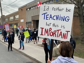 Teachers protest outside LaSalle Community Comprehensive High School during strike action April 14, 2021.