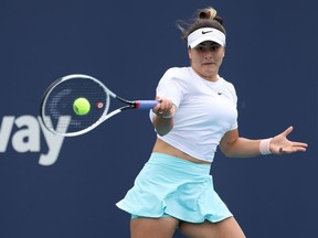 Bianca Andreescu of Canada hits a forehand against Ashleigh Barty of Australia in the women's singles final in the Miami Open at Hard Rock Stadium on Saturday, April 3, 2021.