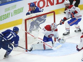 Maple Leafs' Zach Hyman roofs the puck past Canadiens goalie Jake Allen for what proved to be the winning goal in the third period Wednesday night in Toronto.