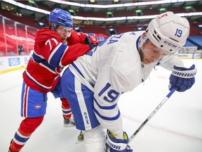 Leafs' Jason Spezza is shoved by Canadiens rookie Jake Evans during game at the Bell Centre in February.