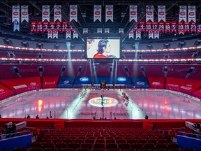 Montreal Canadiens and Toronto Maple Leafs line up for the national anthem in the empty Bell Centre in Montreal on Feb. 10, 2021.