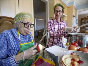 Ethel Smith helps her 88-year-old mother Sylvia peel apples at her home. In early 2020, Sylvia Smith started making applesauce at home and then selling it by word of mouth but has also launched a Facebook page to market goods with help of her daughters.