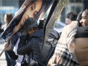 People march against domestic violence in the memory of Rebekah Love Harry April 3, 2021.