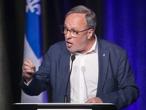 Daniel Boyer, president of the FTQ, speaks to reporters on May 2, 2021, following a meeting with Quebec Premier François Legault and Quebec Treasury Board president Sonia LeBel.