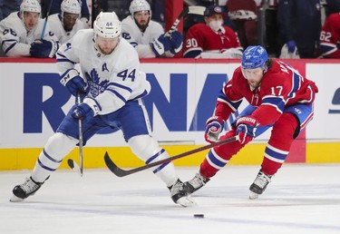 Josh Anderson forechecks against Morgan Rielly of the Toronto Maple Leafs during first-period action in Montreal on Monday May 3, 2021.
