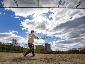 Frank St-Jacques takes his cuts at the plate on the softball diamond at Parc Jeanne-Mance in Montreal Thursday May 6, 2021.