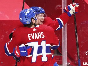 Artturi Lehkonen is congratulated by team-mate Jake Evans after scoring a goal to tie the game during third-period action in Montreal on Monday, May 10, 2021.
