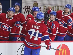 The Canadiens’ Jake Evans is congratulated by teammates after scoring first-period goal in 4-3 OT loss to the Edmonton Oilers Monday night at the Bell Centre.