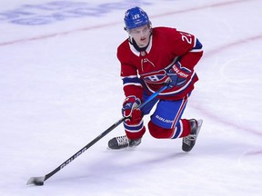 Cole Caufield skates with the puck during overtime against the Edmonton Oilers in Montreal on May 10, 2021.