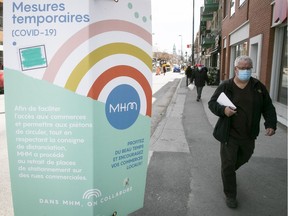 Sign of the times: A placard on Ontario St. urges residents to support local businesses.