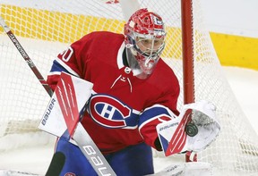 Cayden Primeau makes a trapper save during first-period action in Montreal on Wednesday, May 12, 2021.