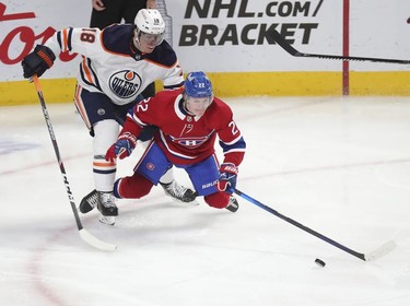 Cole Caufield is shoved from behind by Edmonton Oilers' James Neal during third-period action in Montreal on Wednesday, May 12, 2021.