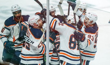 The Edmonton Oilers celebrate their overtime win against the Montreal Canadiens at the Bell Centre on Wednesday, May 12, 2021.