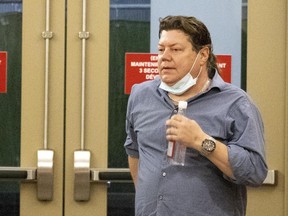 Sylvain Houde prepares to enter the courtroom to testify in the trial of Jeremie McLaughlin-Thibault in Montreal on Thursday May 13, 2021.