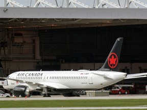 An Air Canada jet is seen at a maintenance hangar at Trudeau airport in Montreal.
