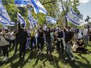 People attend a pro-Israel rally at Dorchester Square in Montreal Sunday, May 16, 2021. 