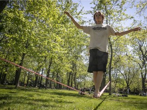 Teo Leduc practices his slack-line technique at Molson park on May 17, 2021.
