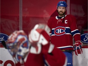 Canadiens captain Shea Weber looks on as goalie Carey Price makes a save during pregame warmup before a game at the Bell Centre against the Vancouver Canucks this season.
