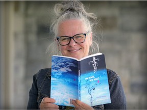 Debbie Magwood, founder and director of the West Island Cancer Wellness Centre, holds a copy of the posthumously published We root, We leaf book.