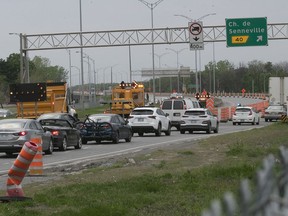 Cars are diverted away from the Île-aux-Tourtes Bridge in May 2021 because of emergency repairs. If an indefinite lane closure on the bridge made with little warning and no mitigation measures in late December was an outrage, the belated response from the Transport Ministry has been a joke, Allison Hanes writes.