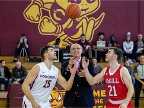 George Lengvari Jr., centre, performs ceremonial tip-off between team captains Olivier Simon, left, and Sam Jenkins at the 2020 Lengvari Cup basketball rivalry game at Concordia University on Feb. 15, 2020.