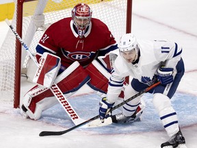 Maple Leafs' Zach Hyman parks himself in front of Canadiens goaltender Carey Price during Game 3 in Montreal.