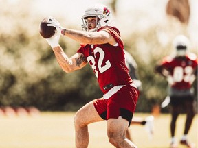 Montreal's Bruno Labelle, a tight end for the Arizona Cardinals, hauls in a pass at the team's practice facility in Tempe, Ariz.