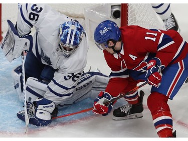 Canadiens' Brendan Gallagher (11) tries to shake puck loose in the glove of Toronto Maple Leafs goaltender Jack Campbell during second period action in Game 6 of the first round NHL playoff series in Montreal on Saturday. May 29, 2021.