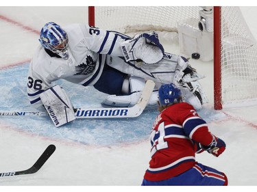 MONTREAL, QUE.: MAY  29, 2021 --

Toronto Maple Leafs goaltender Jack Campbell deflects puck away from the net on shot by Montreal Canadiens' Eric Staal (21) during second period action, in game six of the first-round NHL playoff series in Montreal on Saturday May 29, 2021. (Pierre Obendrauf / MONTREAL GAZETTE) ORG XMIT: 66217 - 4051