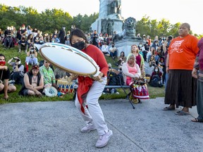 Lucy Tulugarjuk drums, sings, and dances during a commemorative drumming session in Montreal Monday May 31, 2021 in memory of the 215 Indigenous children whose remains were found in a mass grave at a former residential school in Kamloops, B.C.