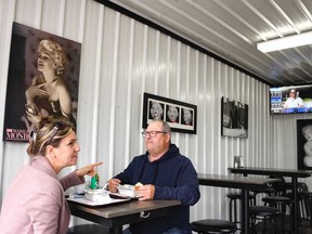 Jean Rioux and Judith Létourneau dine in at La Patate Royale 2.0 in St-Jean-sur-Richelieu on Monday, May 31, 2021. Starting Monday, Montreal and Laval join St-Jean as orange zones, allowing indoor dining.