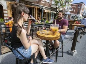 Pub West Shefford customers enjoy drinks on the terrasse of the resto-bar in Montreal's Plateau Mont-Royal district Thursday June 25, 2020.