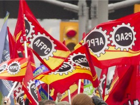 Flags for PSAC/AFPC at a union protest.