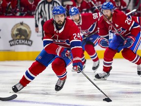 Montreal Canadiens Phillip Danault carries the puck across the Winnipeg Jets blueline trailed by team-mates Jeff Petry, right, and Tomas Tatar during first period of National Hockey League game in Montreal Thursday April 8, 2021.