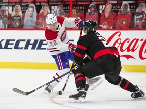 Cole Caufield #22 of the Montreal Canadiens shoots the puck against Artem Zub #2 of the Ottawa Senators during the first period at Canadian Tire Centre on May 5, 2021 in Ottawa, Ontario, Canada.