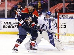Jonathan Huberdeau of the Florida Panthers looks for a pass in front of goaltender Andrei Vasilevskiy of the Tampa Bay Lightning at the BB&T Center on May 8, 2021, in Sunrise, Fla.