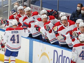 The Canadiens’ Paul Byron is congratulated by teammates on the bench after scoring the game-winning goal short-handed in a 2-1 victory over the Maple Leafs in Game 1 of first-round playoff series Thursday night in Toronto.
