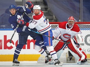 Canadiens' Brett Kulak (77) battles Maple Leafs'  Ilya Mikheyev in Game 2 of the first round of the 2021 Stanley Cup Playoffs at Scotiabank Arena on Saturday, May 22, 2021, in Toronto.