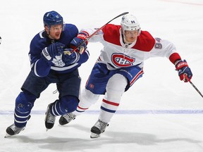 Canadiens' Corey Perry battles against Zach Hyman of the Toronto Maple Leafs in Game 2 of the first round of the 2021 Stanley Cup Playoffs at Scotiabank Arena on Saturday, May 22, 2021, in Toronto.