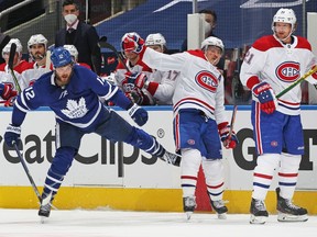 Brendan Gallagher #11 of the Montreal Canadiens slams into Alex Galchenyuk #12 of the Toronto Maple Leafs in Game Two of the First Round of the 2021 Stanley Cup Playoffs at Scotiabank Arena on May 22, 2021 in Toronto, Ontario, Canada.