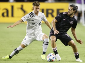 CF Montréal's Amar Sejdic, left, defends against Inter Miami FC's Rodolfo Pizarro during game in Fort Lauderdale, Fla., on Wednesday.