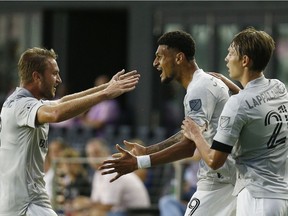 Bjørn Johnsen (#9) of CF Montréal celebrates his goal in the 14th minute with Djordje Mihailovic (#8) against Inter Miami CF during the first half at DRV PNK Stadium on May 12, 2021 in Fort Lauderdale.